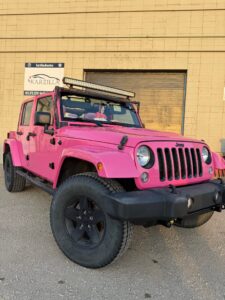 a pink jeep that had a vinyl car wrap done by Karzilla in Edmonton
